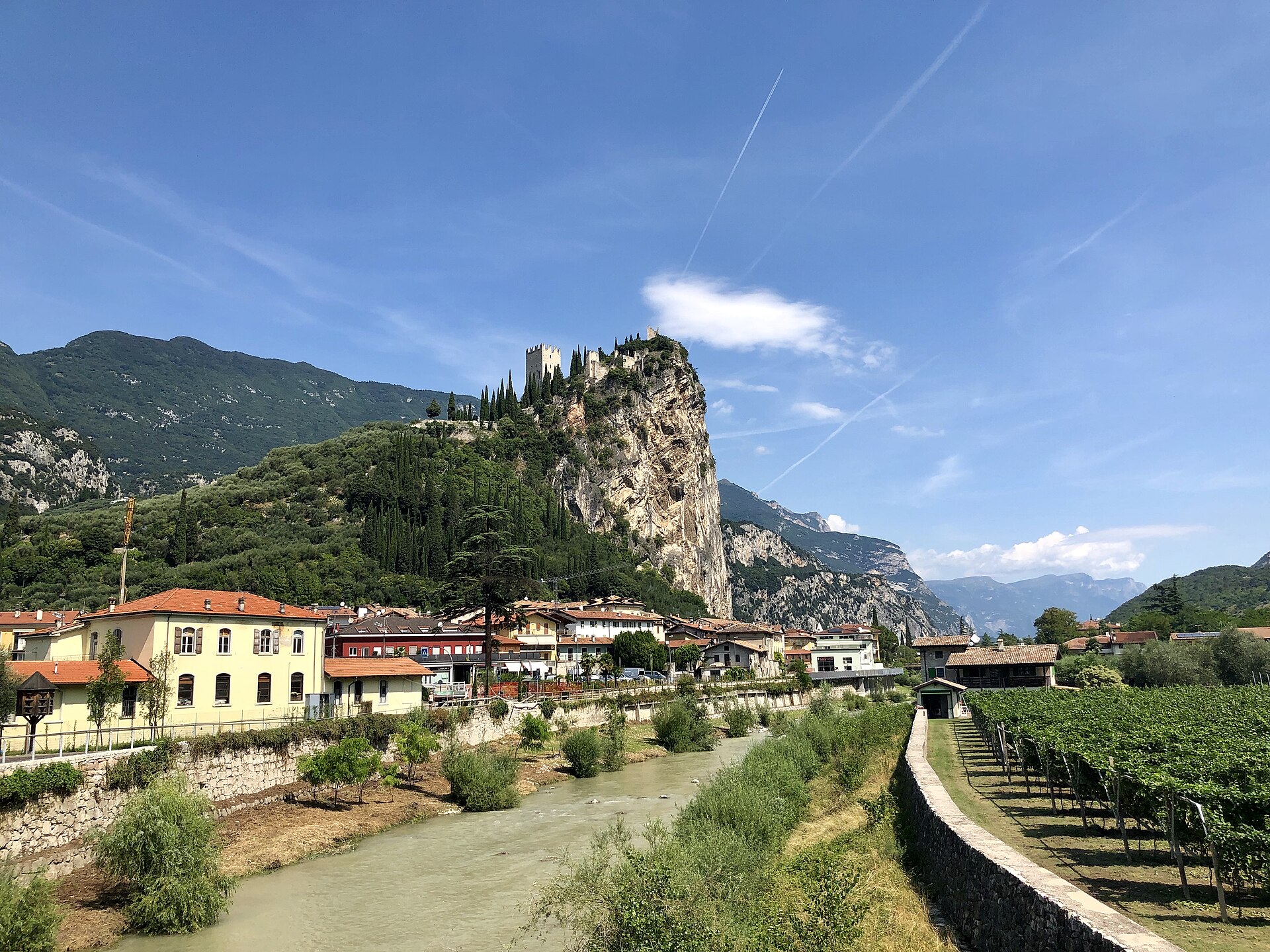 Arco Castle on its limestone rock above the town and Sarca river