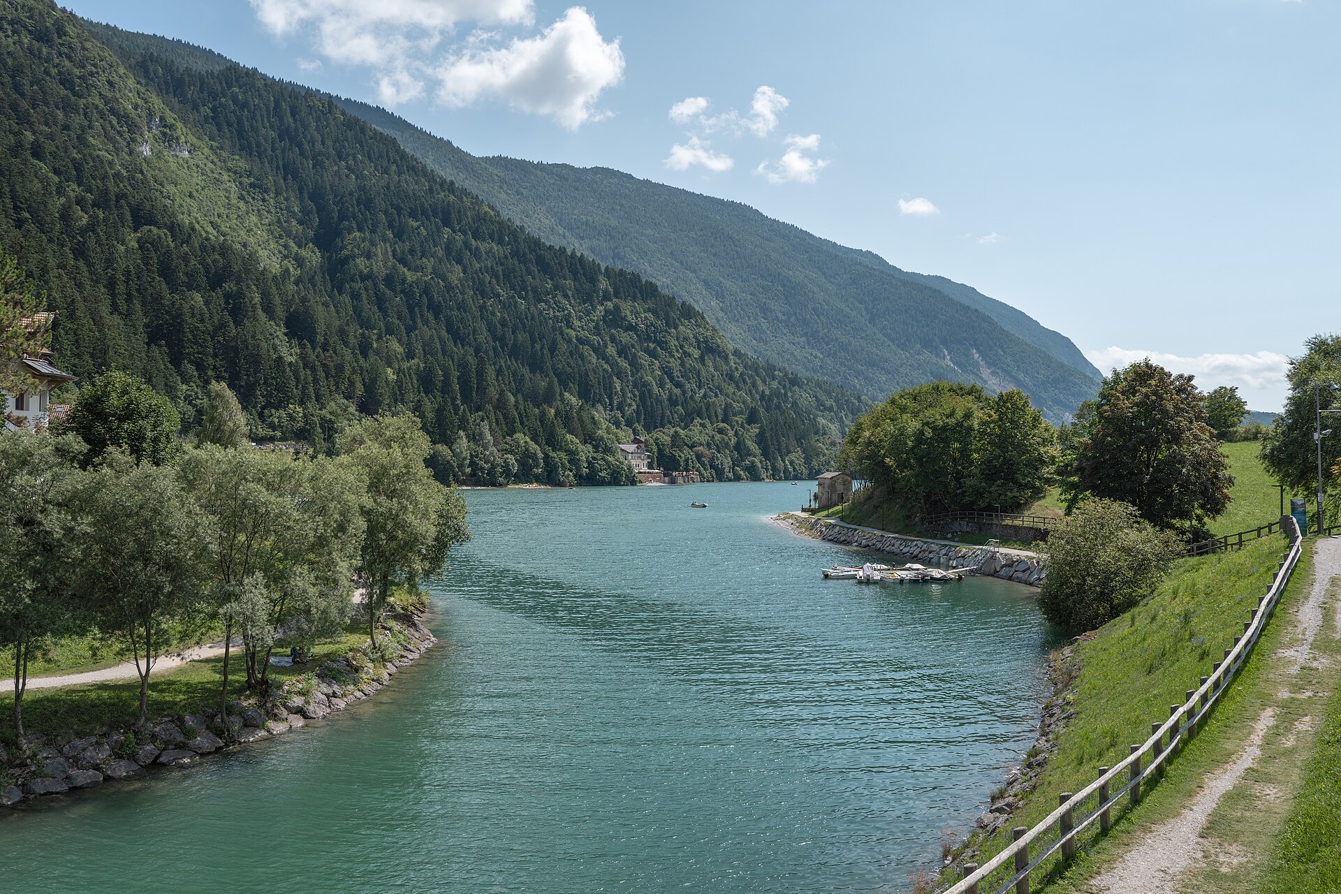 Waterside path and small boats on the northern shore of Lake Molveno