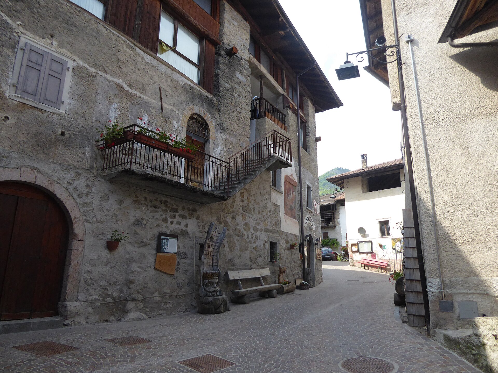Stone houses and a quiet lane in Rango on the Bleggio plateau
